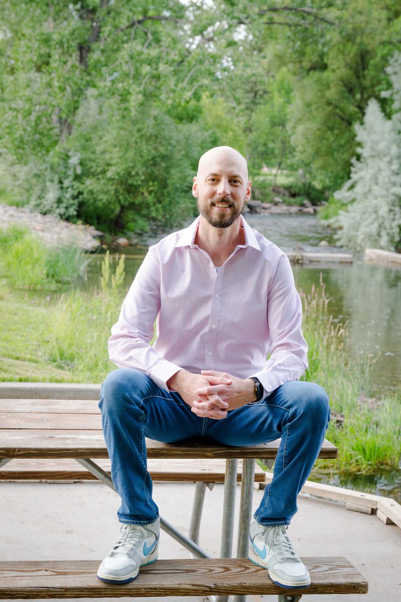 Michael Calabrese sitting on a picnic table in a Rapid&nbsp;City park