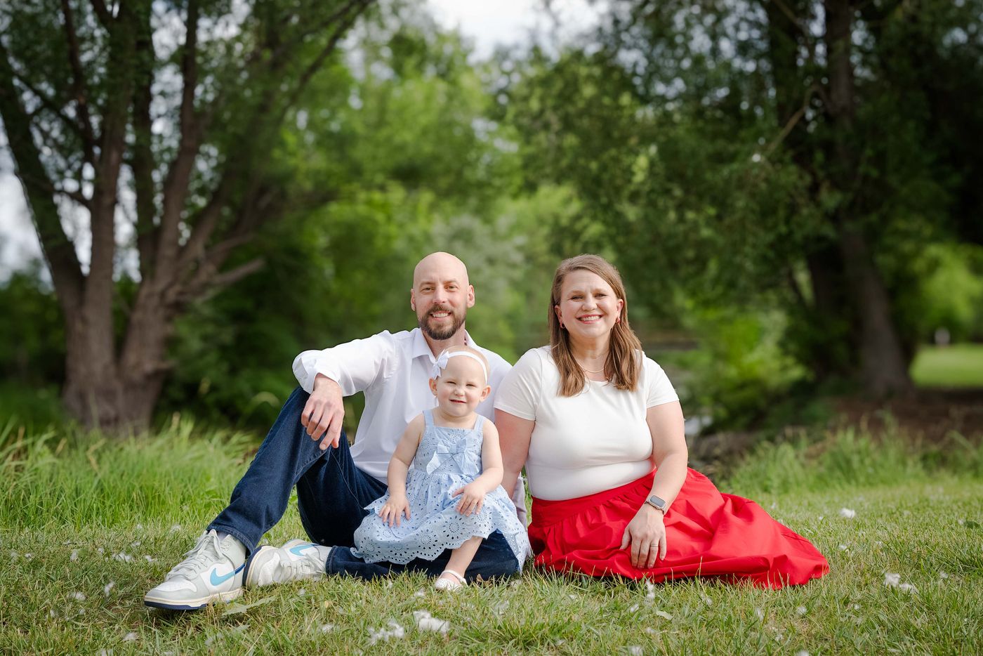Michael and Jennifer Calabrese with their daughter on the grass in a Rapid&nbsp;City park